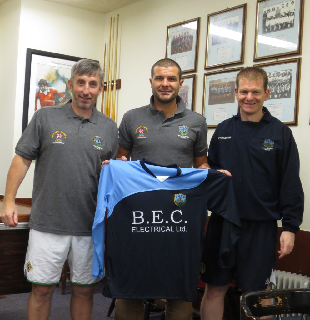 Ross Hayes of BEC Electrical Ltd presents the new strip to the 1st team mangers Colin & Keith